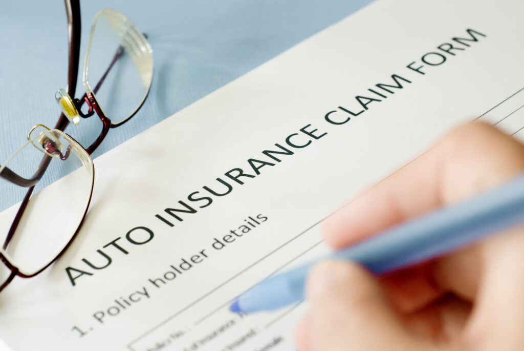 Auto insurance claim form sitting on desk