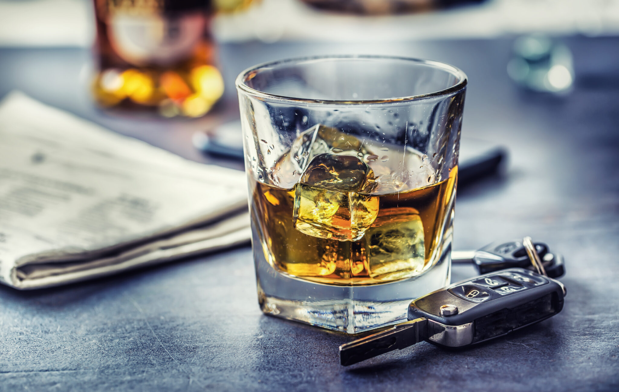 Glass of whiskey and car keys