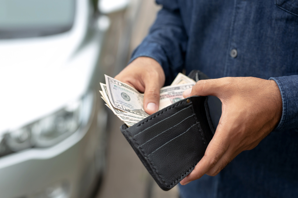 Man getting money out of wallet